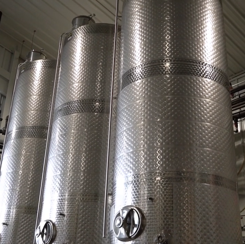 Dimpled cooling jacket on a tank